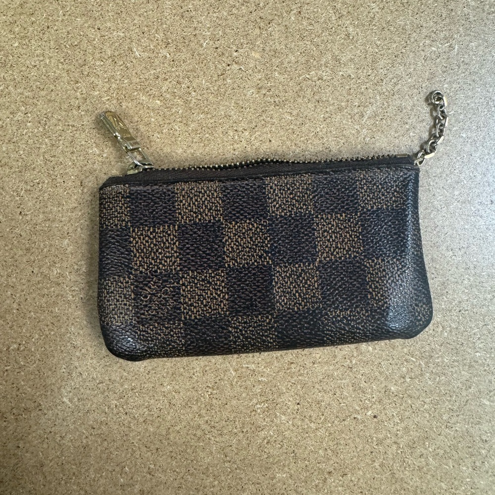 Louis Vuitton wallet in brown.